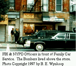 [Photo: Police in front of bombers HQ ]